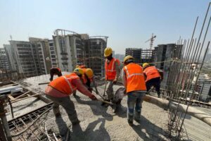 Migrant labourers at a construction site.